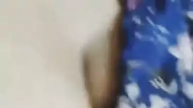 Desi woman in floral robe teases lover demonstrating big breasts